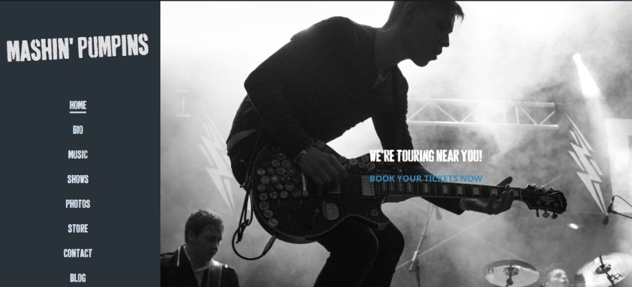 My test site created using Bandzoogle. A black and white image of a guitarist jumping in the air with my main menu running down the left hand side of the screen.